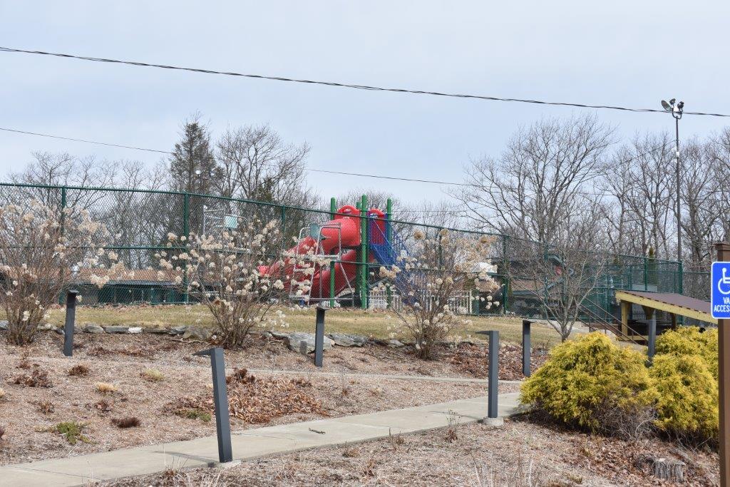 An image from the sidewalk looking at the playground